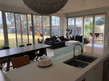 Open Plan Kitchen and living area overlooking the tennis court and pool area